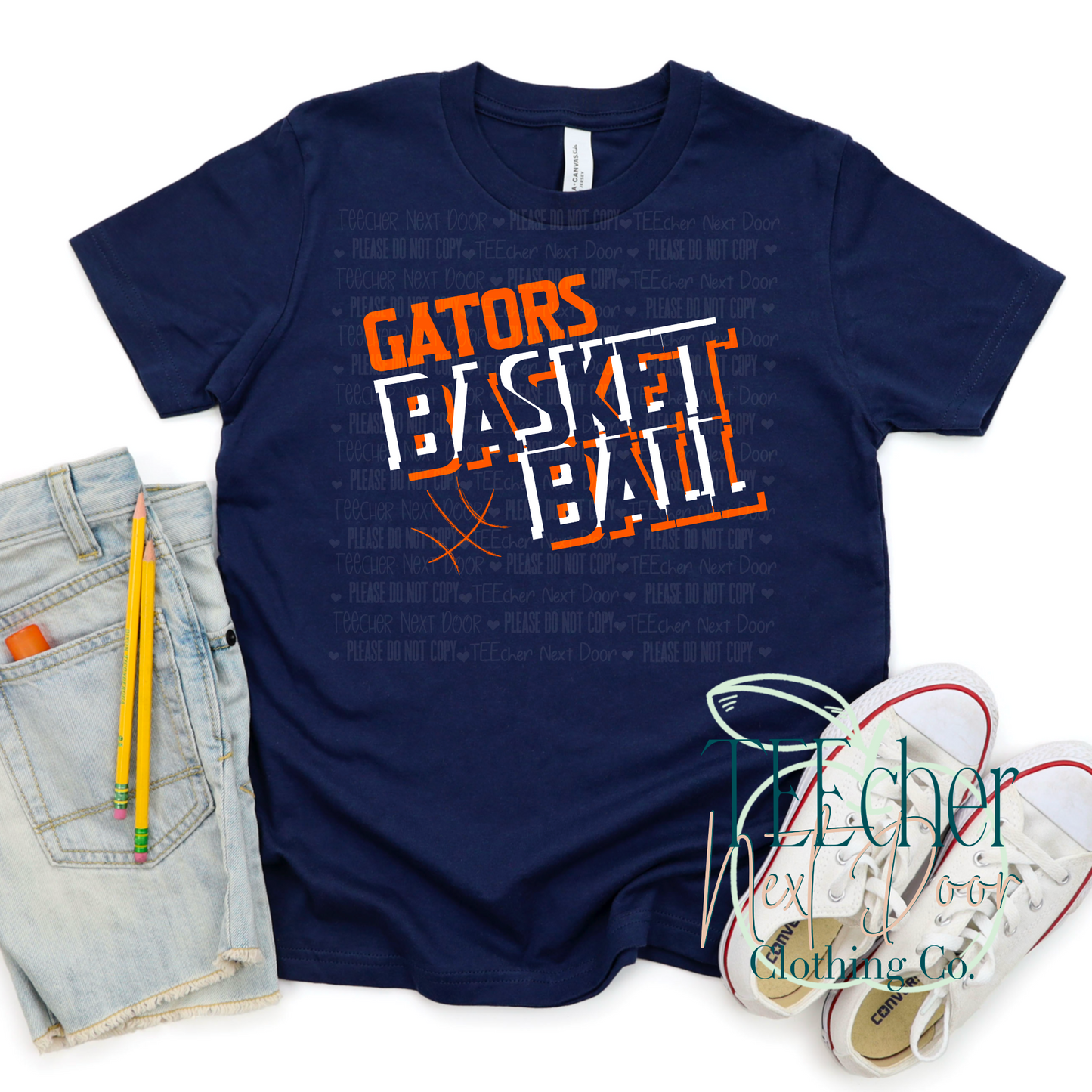 Navy blue t-shirt with 'Gators Basketball' text, jeans, pencil, and sneakers on a white background.