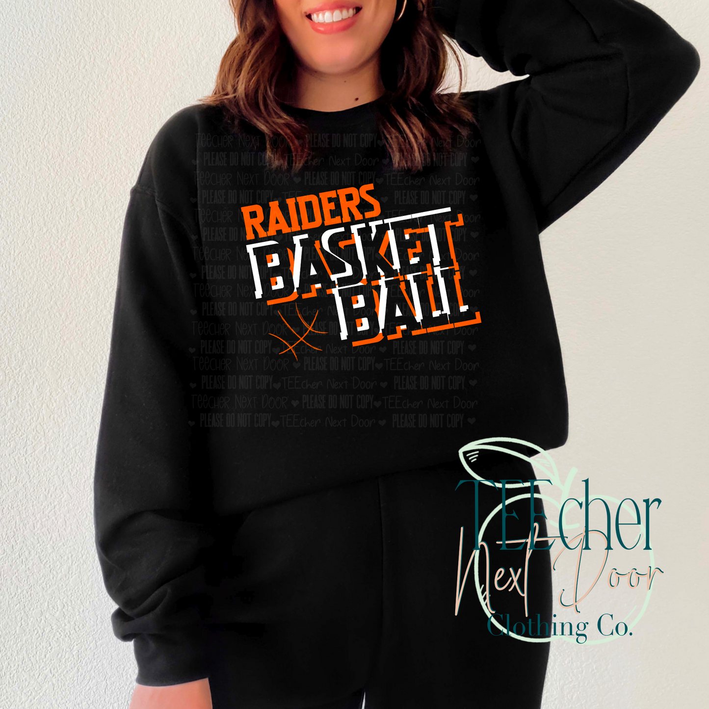 black crewneck with orange raiders basketball