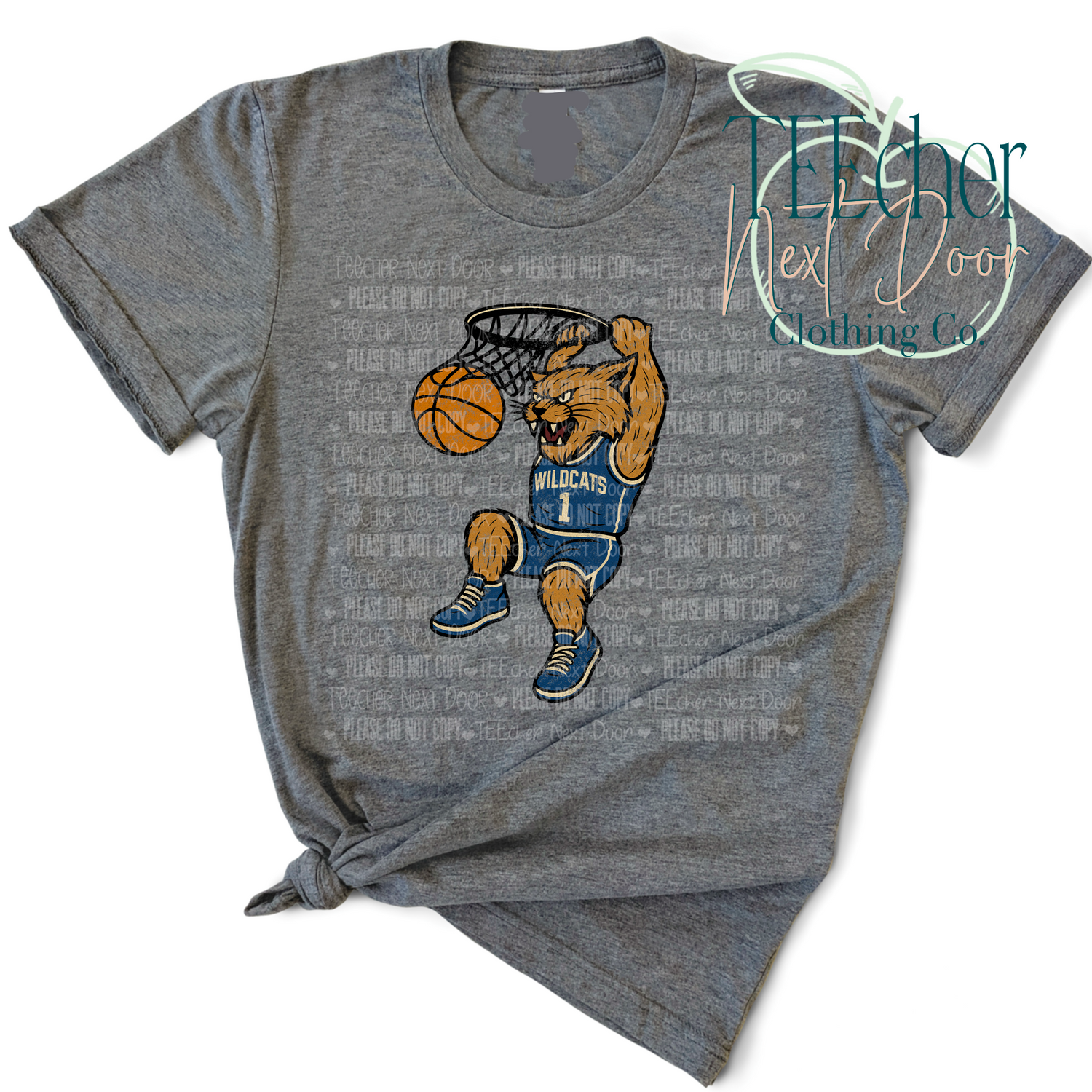 Gray t-shirt with a wildcat playing basketball graphic on a white background