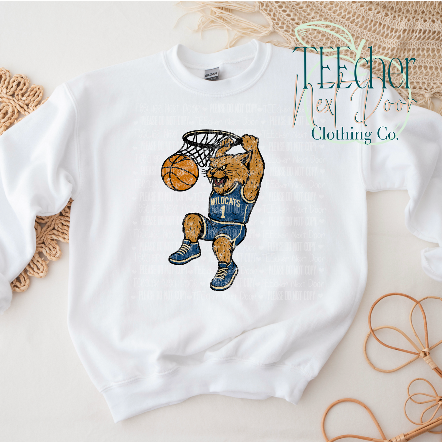 White sweatshirt with wildcat basketball player graphic and 'TEEcher Clothing Co.' branding.